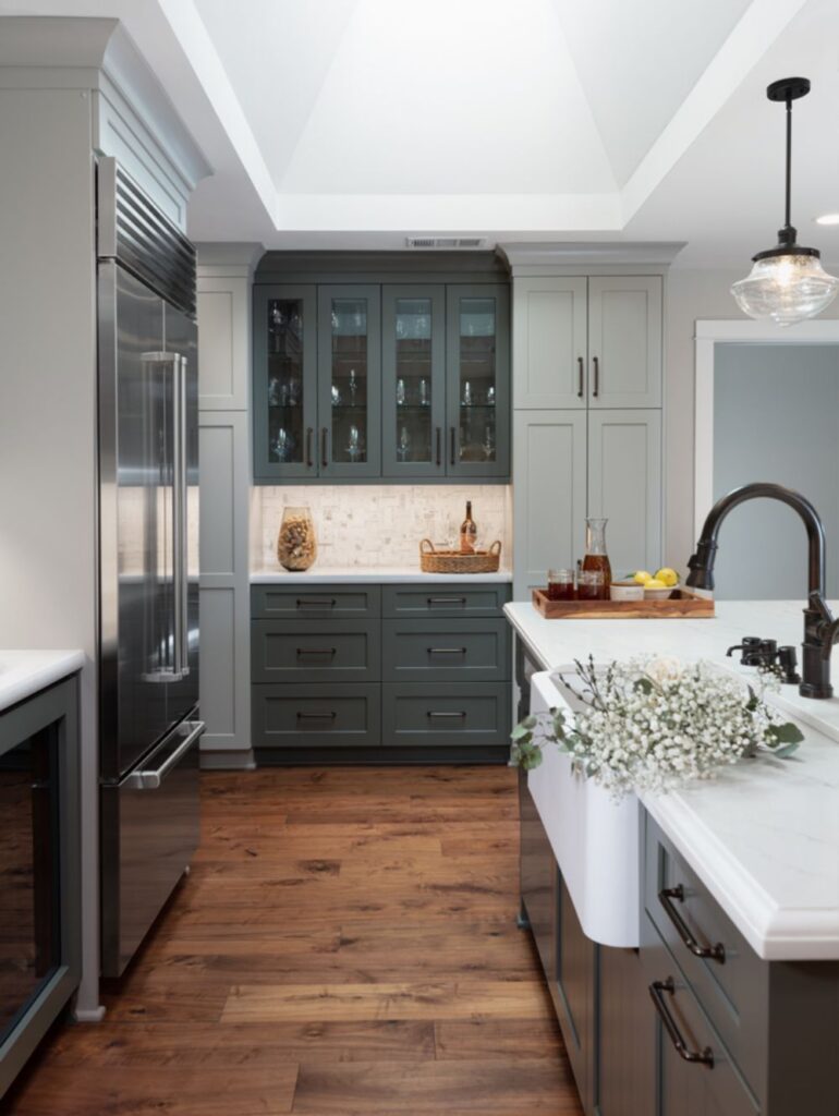 Large kitchen island surrounded by custom cabinetry