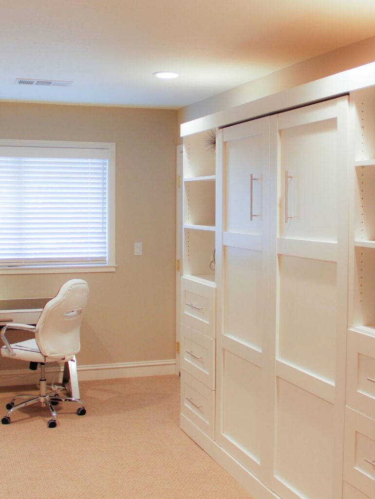 Desk space with built-in storage units and carpet
