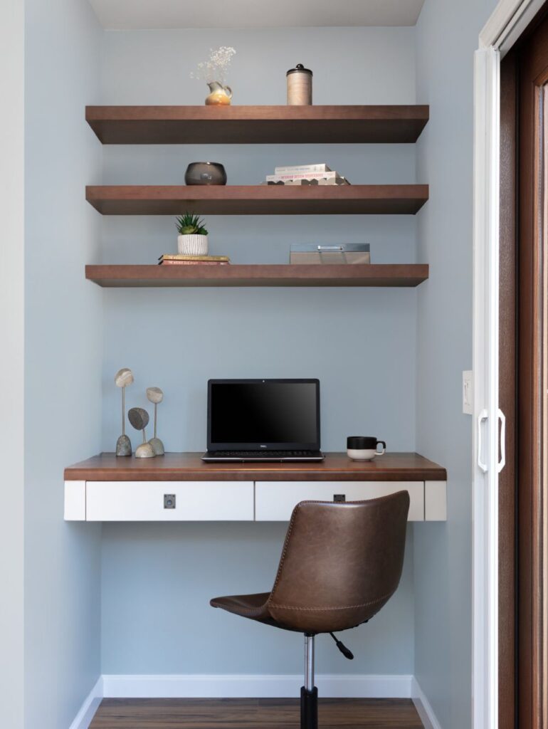 Small desk area with modern finishes and a light blue wall